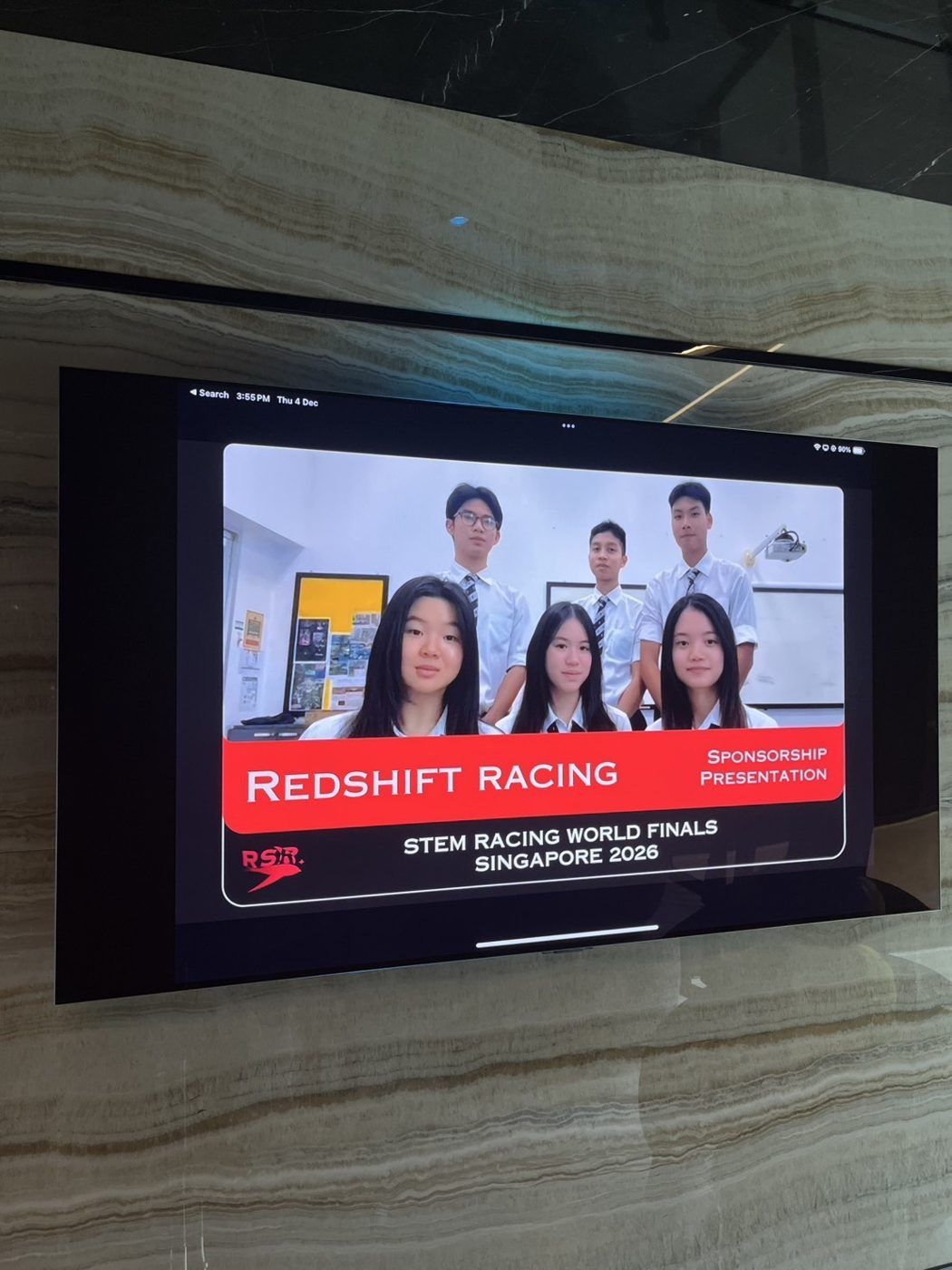 Team on screen during the sponsorship presentation